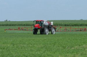Crop sprayer sitting in a grassy field