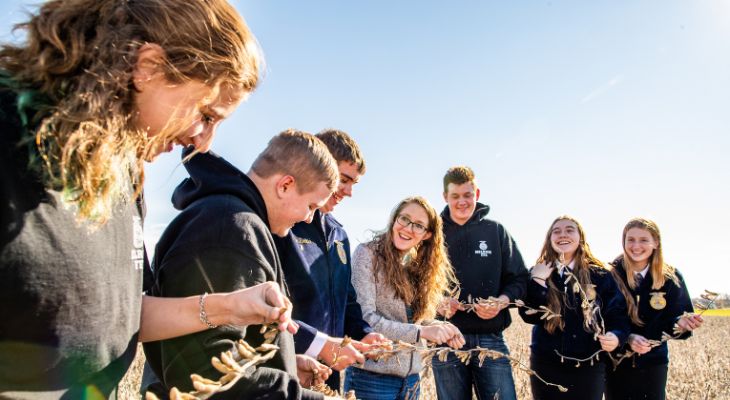 Students standing in a field